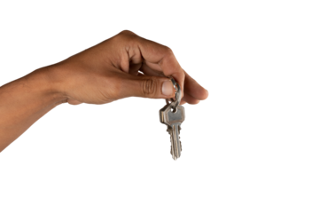 Black male hand holding key to house or business isolated