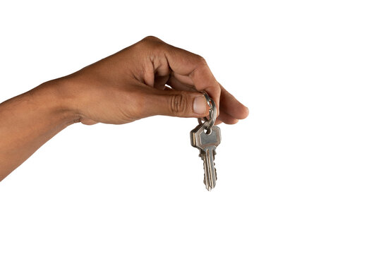 Black male hand holding key to house or business isolated