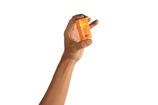 black male hand holding an Orange battery isolated