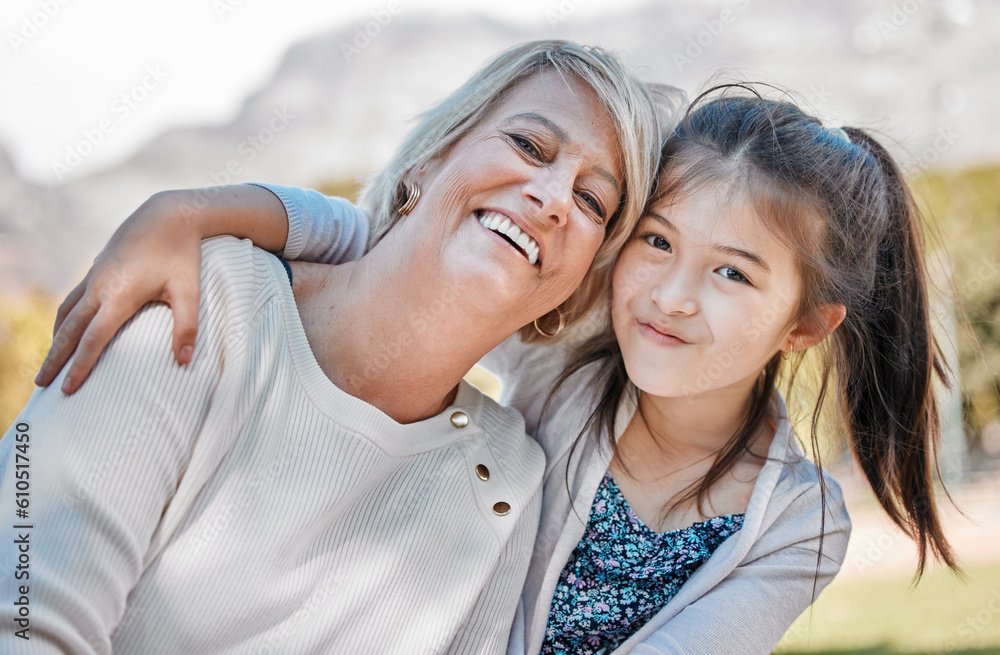 Wall mural Grandmother, girl and portrait with happiness outdoor and hug for happy family at the park. Female child, woman and face of grandma with love, joy and smile in garden with kids, care or bond together