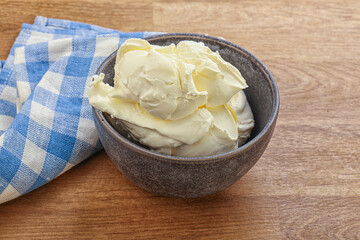Italian soft mascarpone cheese in the bowl