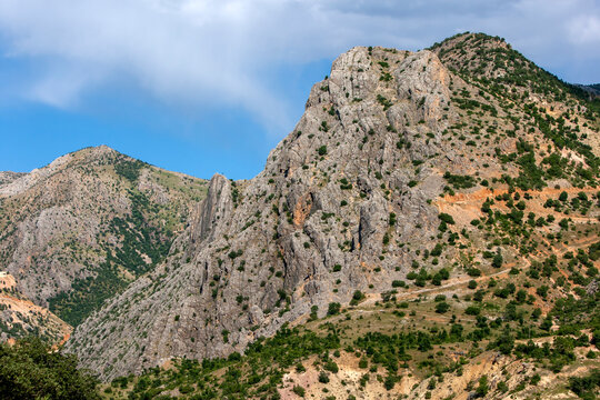 A view from the Arsameia ruins in the Adiyam Province of southeastern Turkiye showing the geology of the surrounding mountain range.