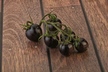 Ripe tasty black cherry tomato