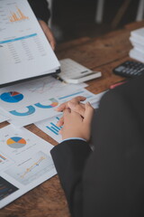 Team of business people working together in the meeting room office, teamwork background charts and graphs banner, double exposure successful teamwork,business planning concept.