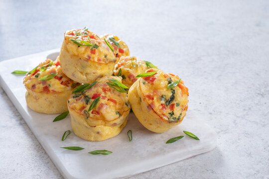 Delicious egg muffins with ham, cheese and vegetables