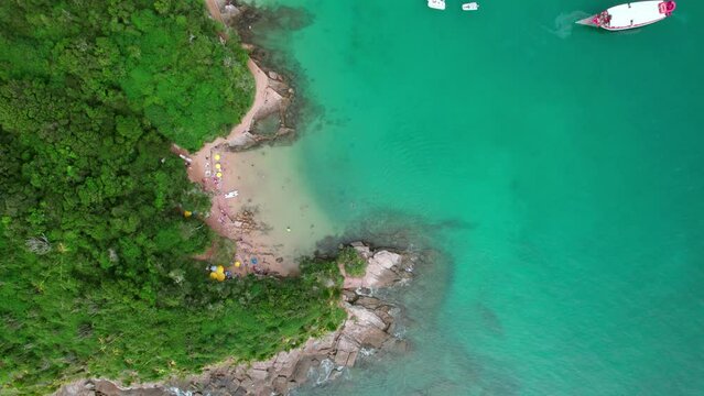 Top view over the azure water of Azedinha beach in B&uacute;zios, Brazil. Drone shot