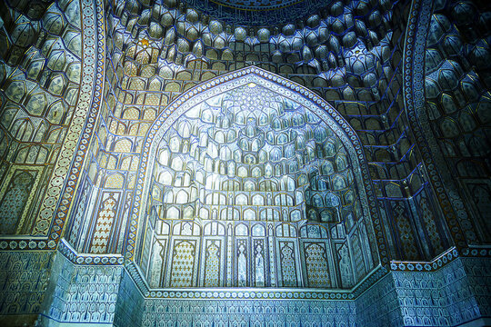 Multicolor tiled mihrab in the ancient mausoleum  close-up