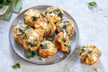 Vegetarian egg muffins with mushroom, spinach and cheese for Breakfast
