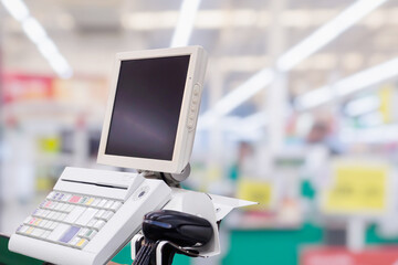 Empty cashier checkout desk with terminal in supermarket