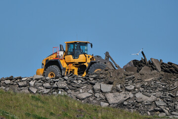 Large Wheel Loaders, another type of machinery such as a dump truck.