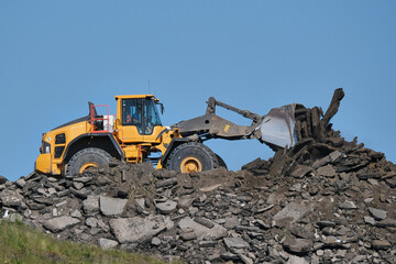 Large Wheel Loaders, another type of machinery such as a dump truck.