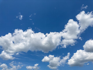 Clouds in the bright sky. There is space for text.