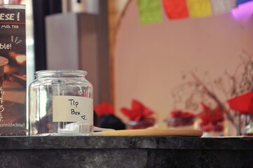Obraz na płótnie Canvas tip box on counter bar in cafe