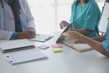 Concentrated medical team using laptop together in the office