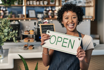 Happy woman, open sign and portrait of waitress at cafe in small business, morning or ready to serve. Female person, restaurant owner or server holding board for coffee shop or cafeteria opening - Powered by Adobe