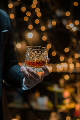  Barman pouring whiskey whiskey glass celebrate whiskey on a friendly party in  restaurant