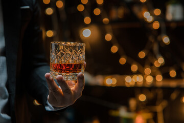  Barman pouring whiskey whiskey glass celebrate whiskey on a friendly party in  restaurant