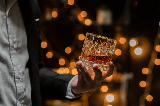  Barman pouring whiskey whiskey glass celebrate whiskey on a friendly party in  restaurant