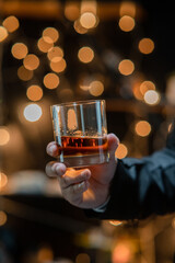  Barman pouring whiskey whiskey glass celebrate whiskey on a friendly party in  restaurant