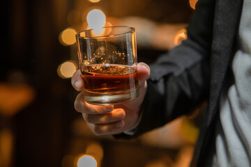 Barman pouring whiskey whiskey glass celebrate whiskey on a friendly party in  restaurant