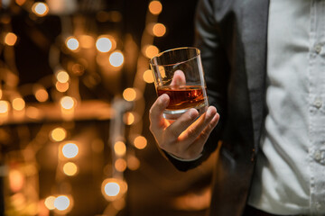  Barman pouring whiskey whiskey glass celebrate whiskey on a friendly party in  restaurant