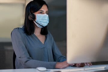 Fototapeta na wymiar Call center, woman and face mask at computer for customer service, telemarketing sales and CRM consulting in office. Female agent, desktop and covid safety for online telecom advice, support and help