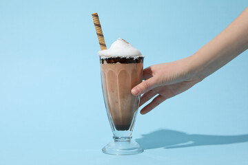 Concept of delicious sweet drink - chocolate milkshake