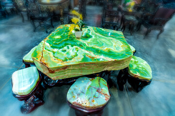 Mineral stone abstract stripes table set is displayed for sale at a second-hand market in Da Lat,...