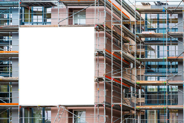 Advertisement billboard on scaffolding,signboard on building facade.Blank information board near...