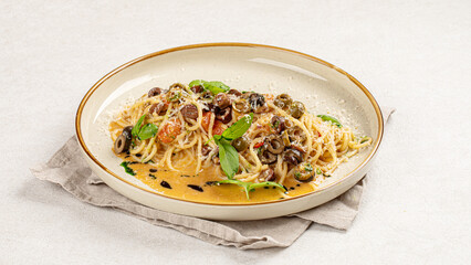 Portion of gourmet pasta spaghetti with kalamata olives