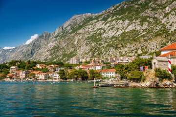 Fototapeta na wymiar Coastline of the Bay of Kotor in Montenegro, accompanied by small houses