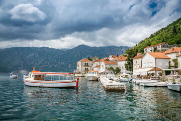 Small harbor with boats in the historic town of Perast in Bay of Kotor