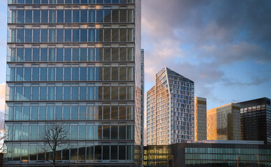 Modern office building in Luxembourg, next to Conference Center, sunset landscape. Travel to...
