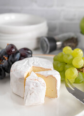 Plate with brie and grapes