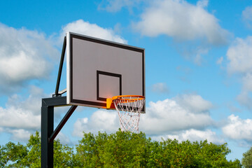 Basketball shield with a ring on outdoor court