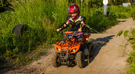 Girl riding an electric quad bike © Angelov