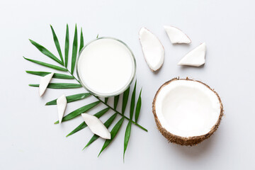 coconut products on white wooden table background. Dairy free milk substitute drink, Flat lay healthy eating