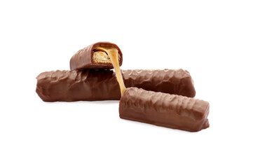 Sweet tasty chocolate bars with caramel on white background