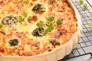 Delicious homemade quiche on table, closeup view