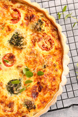 Delicious homemade quiche on table, top view