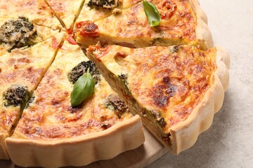 Delicious homemade vegetable quiche on table, closeup