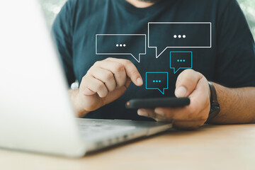 Men using smartphones type live chat chatting and social network concepts, chatting conversation working at home in chat box icons pop up. Social media marketing technology concept.