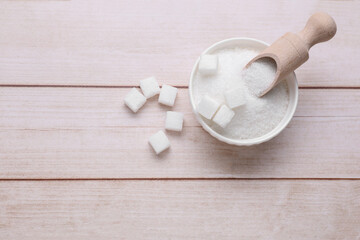 Refined and granulated white sugar on wooden table, flat lay. Space for text