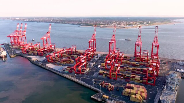 Container port cargo vessel in export import business logistics. Loading by crane in habour and sea transport international aerial top view by drone