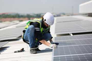 professional technician or engineer installing solar panels, Alternative energy for installed solar...