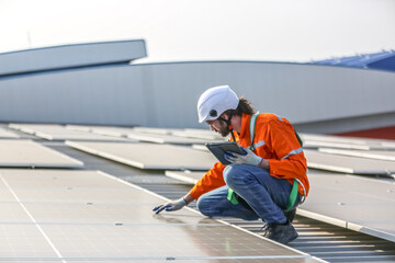professional technician or engineer installing solar panels, Alternative energy for installed solar panels in use on roof of home