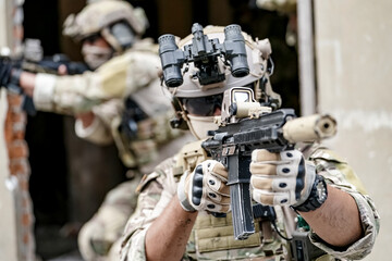 Infantry soldier shooting during military combat training.. Army elite troops marksman, special...