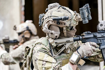 Infantry soldier shooting during military combat training.. Army elite troops marksman, special...