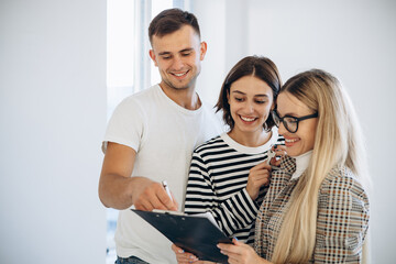 Young family with realtor buying a new house