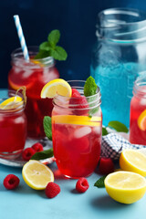on a blue background raspberry mint lemonade fresh generated ai